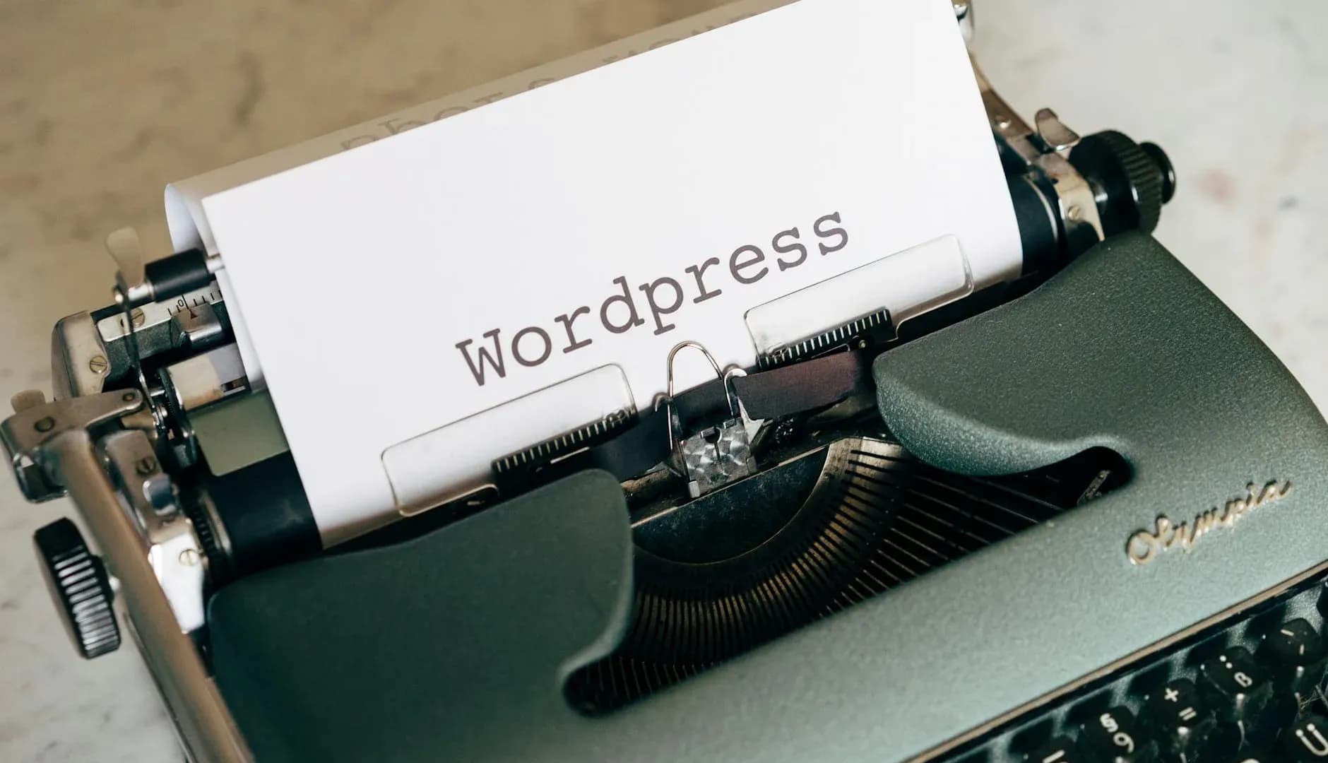 Close-up of a vintage typewriter with a sheet of paper labeled "WordPress," highlighting a blend of old and modern technology.